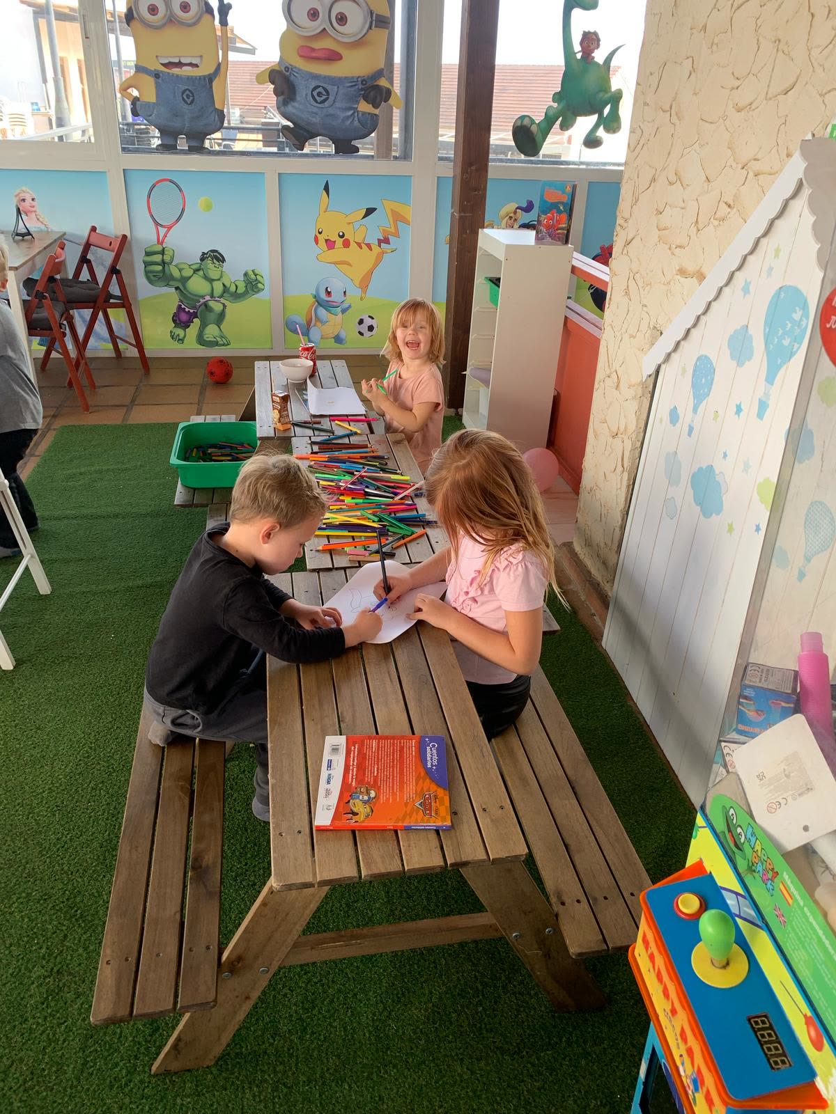 Children taking part in a creative drawing activity at Dream Park